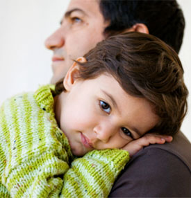 Young boy with his father.